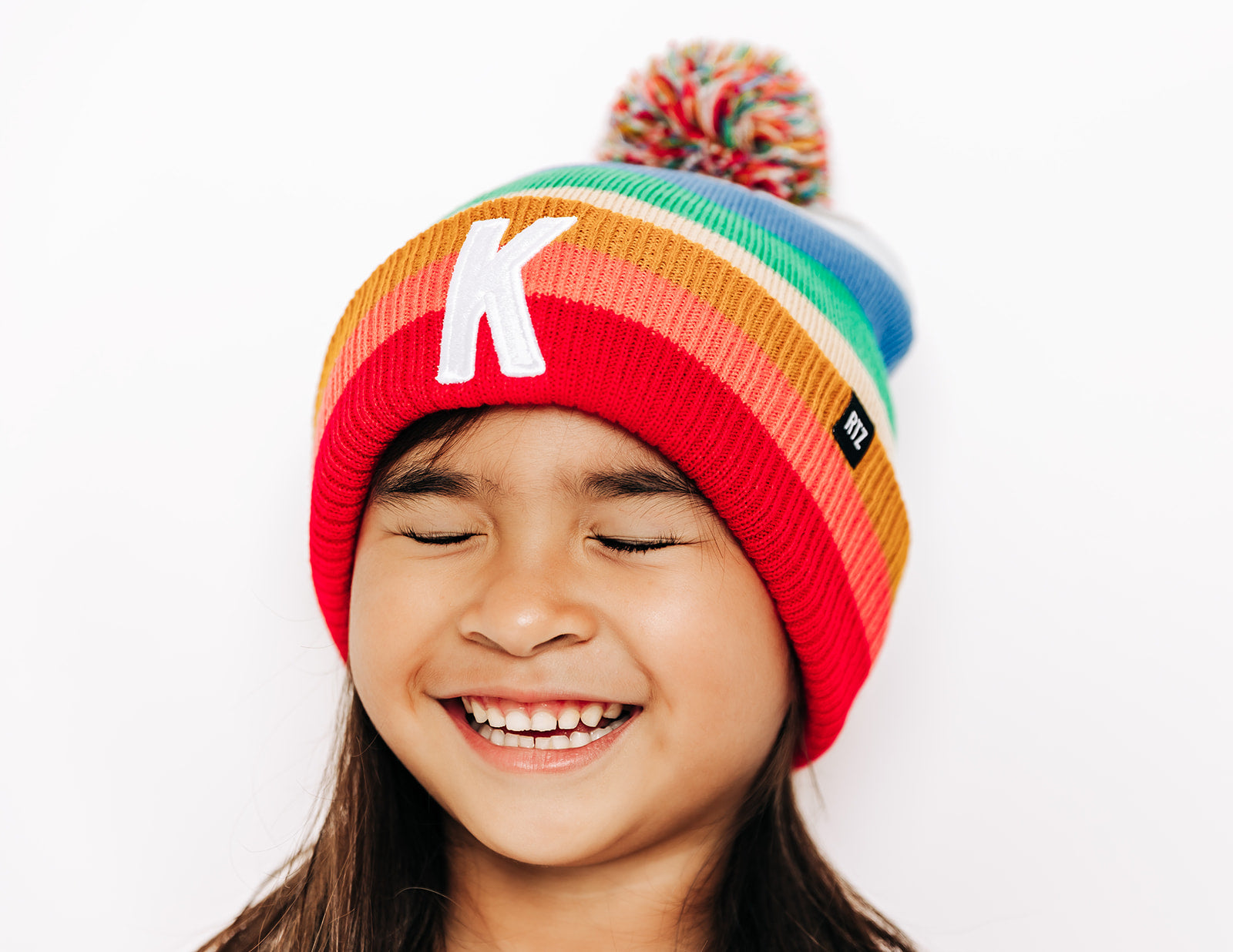 Bright Stripe Letter Pom Pom Hat