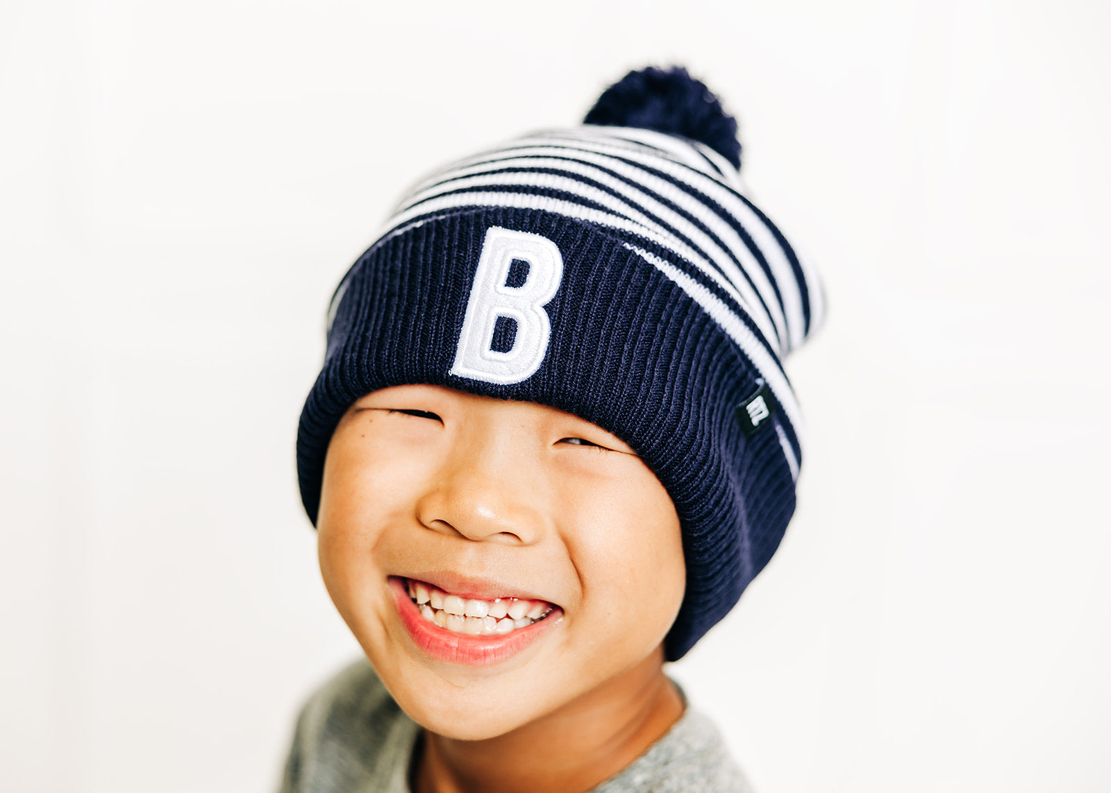 Blue &amp; White Stripe Letter Pom Pom Hat