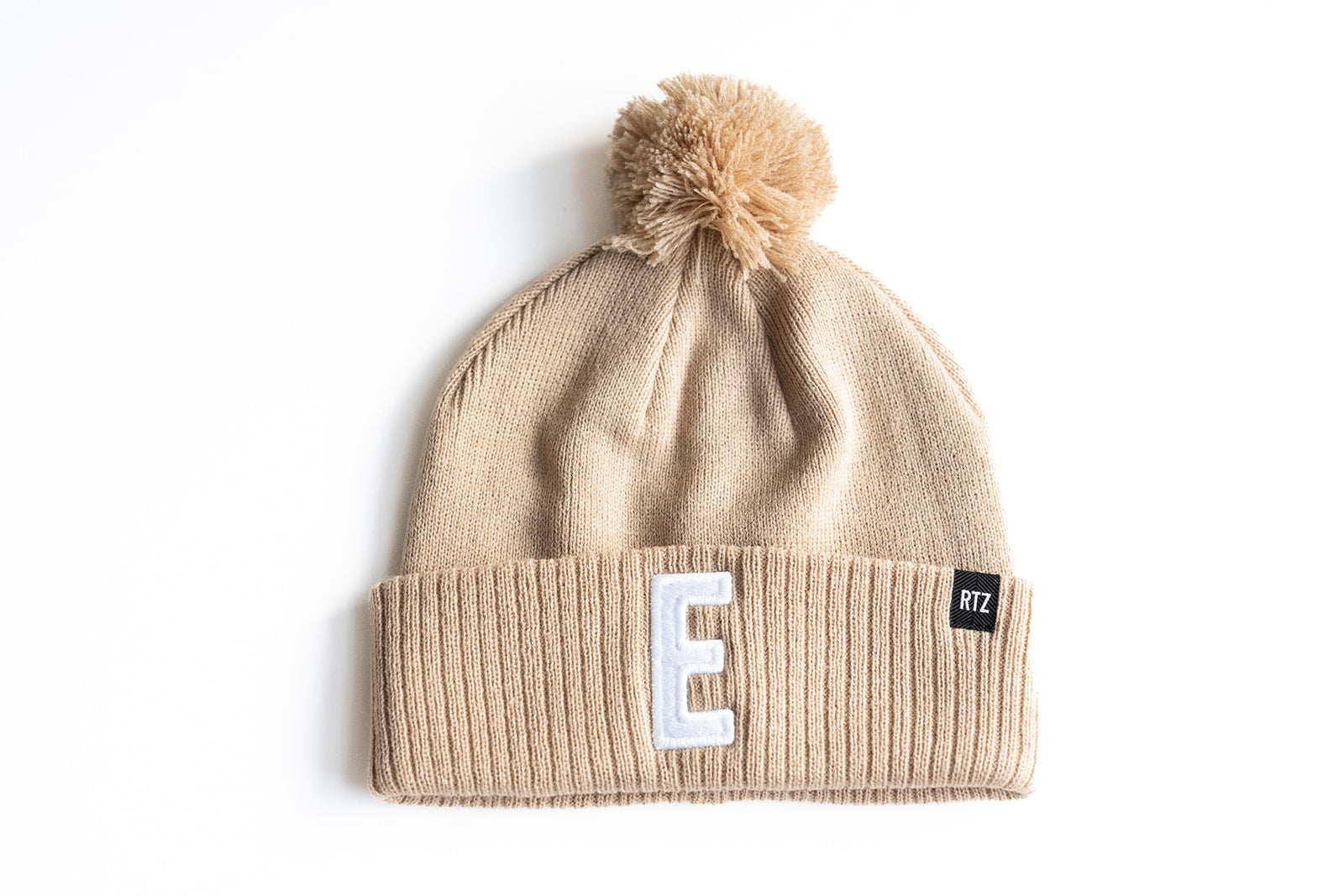 Tan Letter Pom Pom Hat