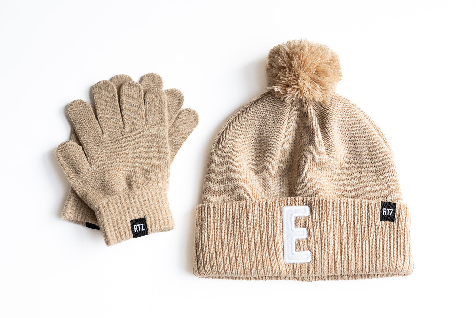 Tan Letter Pom Pom Hat