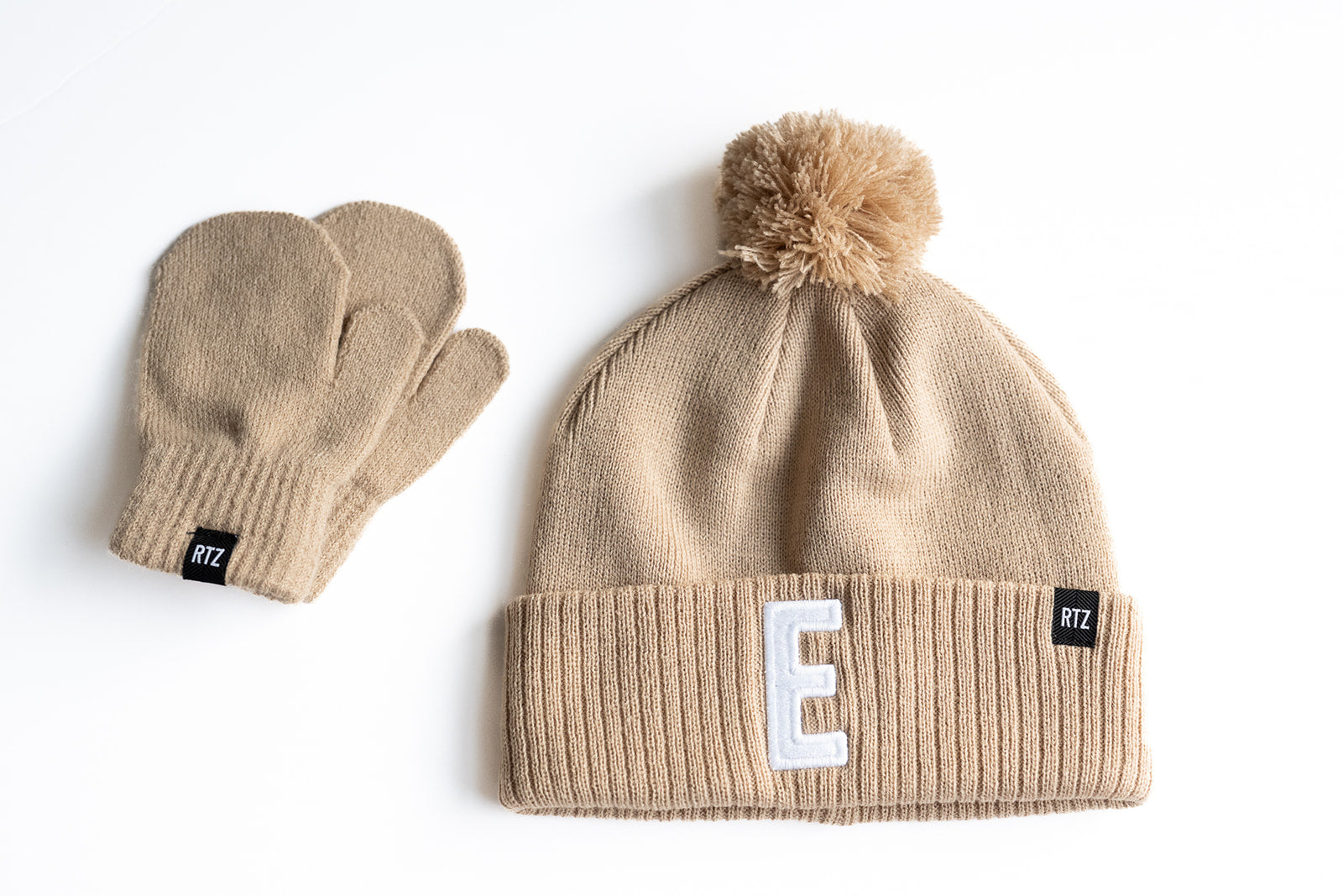 Tan Letter Pom Pom Hat